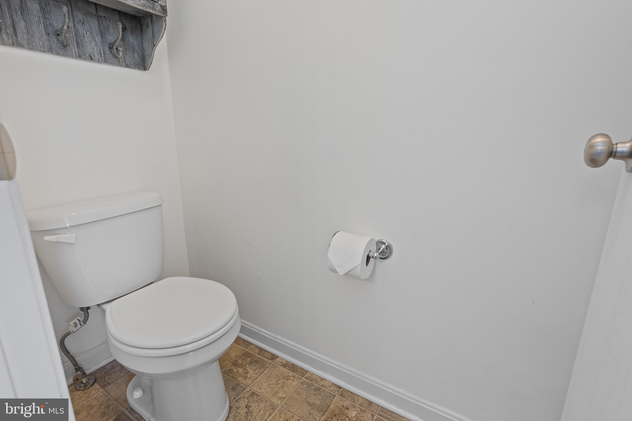 4335 Pleasant Court Huntingtown, MD 20639 - Photo 22 of 46 a white toilet sitting next to a white sink