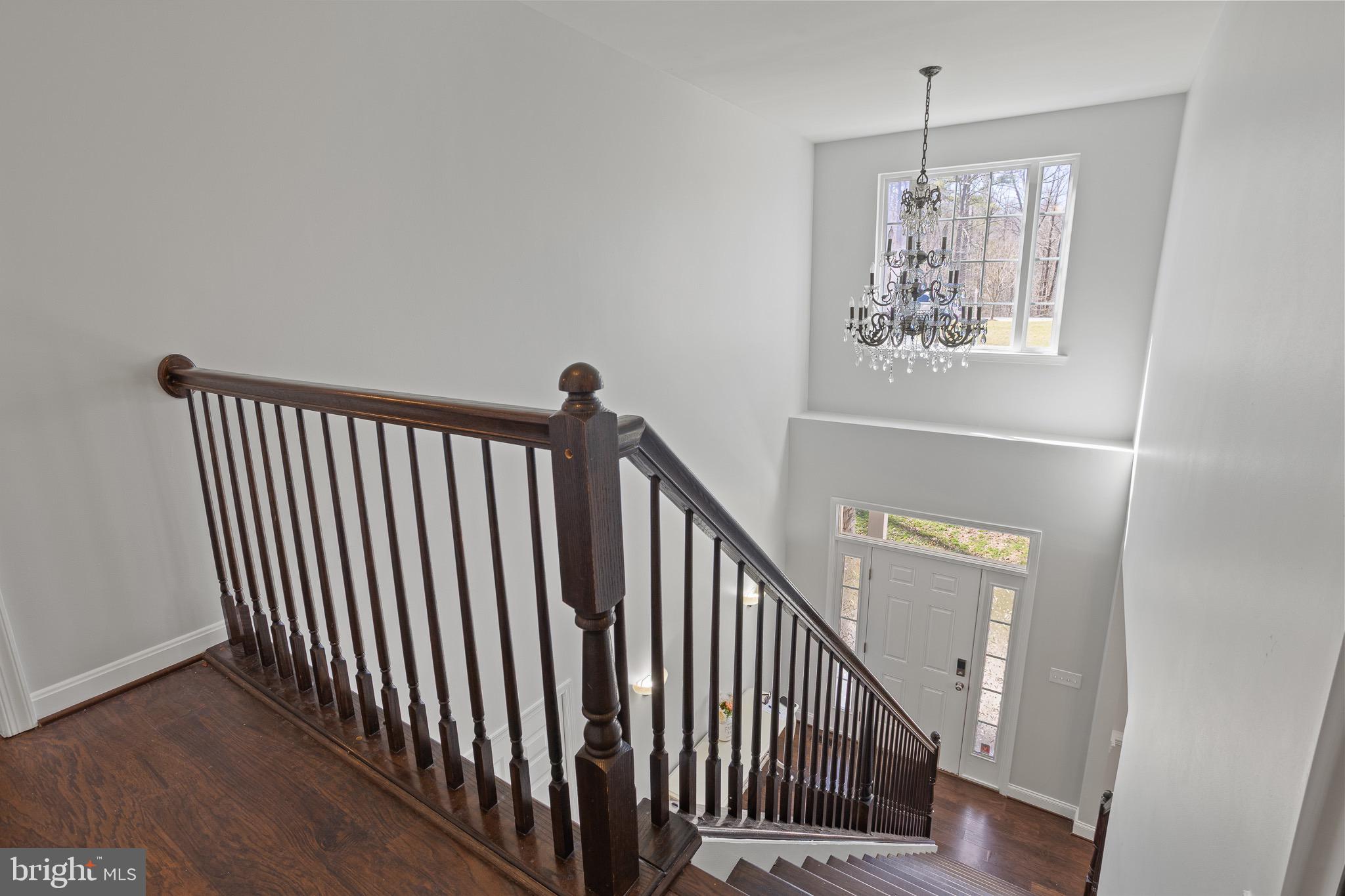 4335 Pleasant Court Huntingtown, MD 20639 - Photo 23 of 46 a view of a hallway with window and stairs