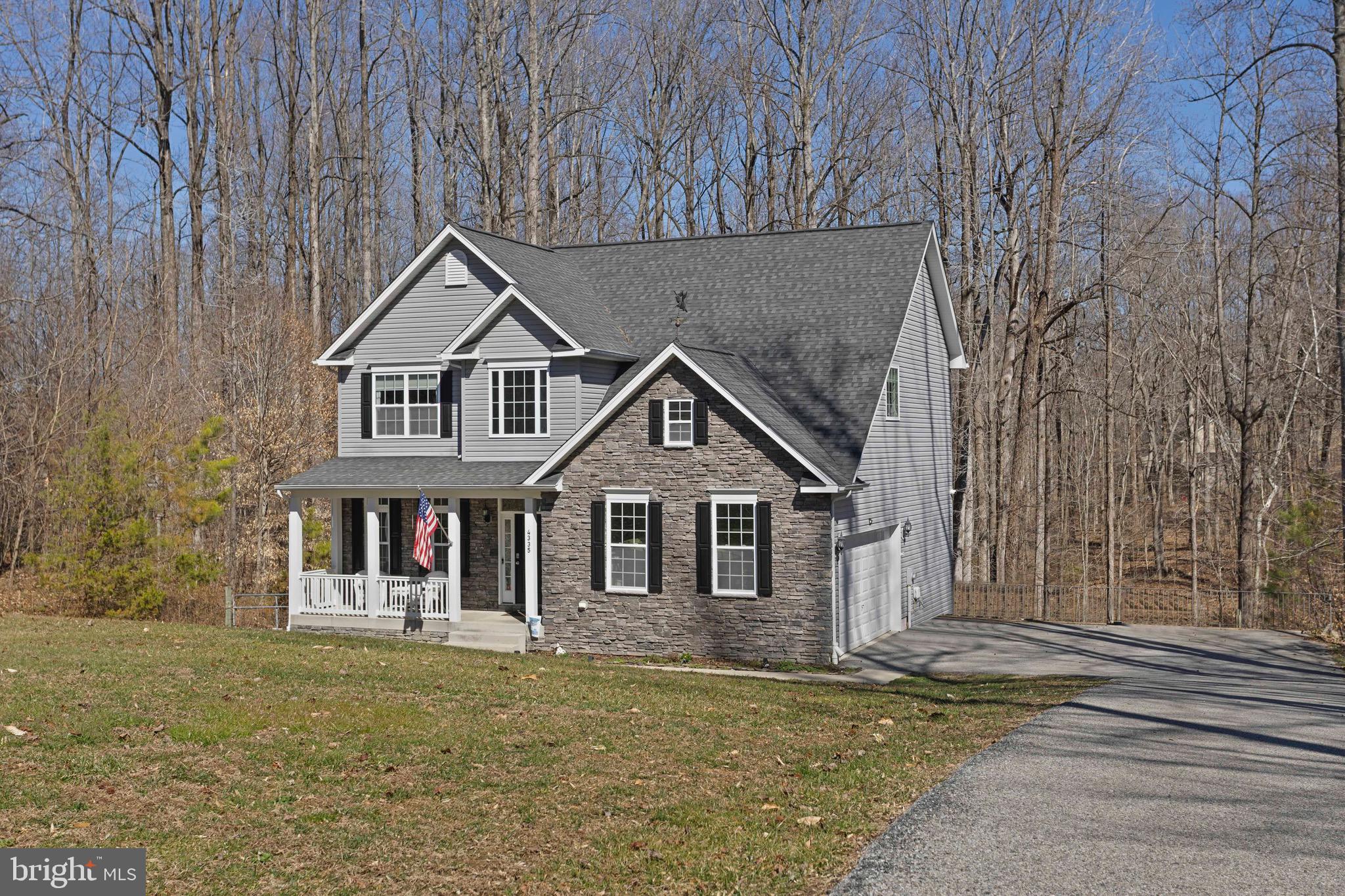 4335 Pleasant Court Huntingtown, MD 20639 - Photo 40 of 46 a front view of a house with garden