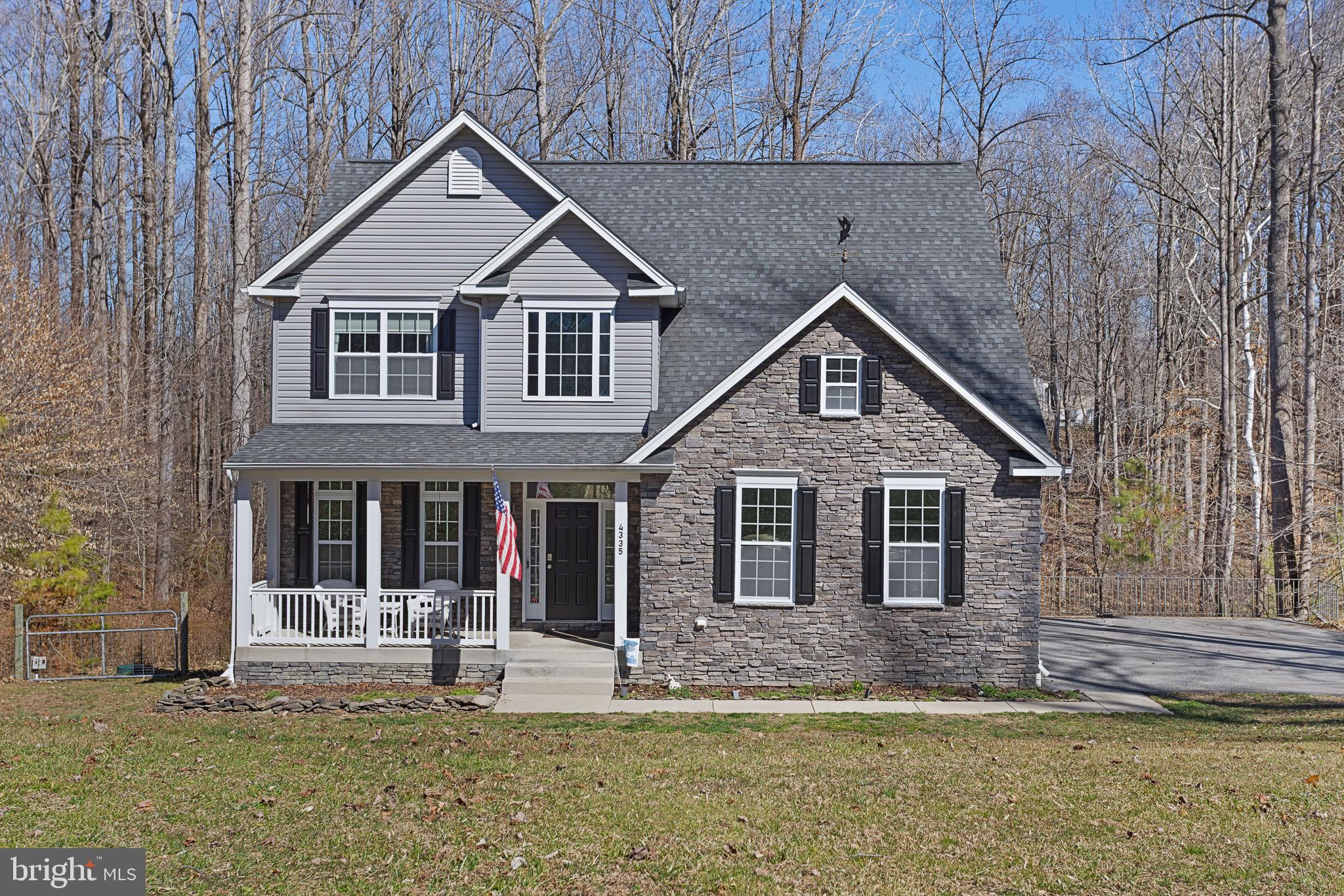4335 Pleasant Court Huntingtown, MD 20639 - Photo 45 of 46 a front view of a house with a yard