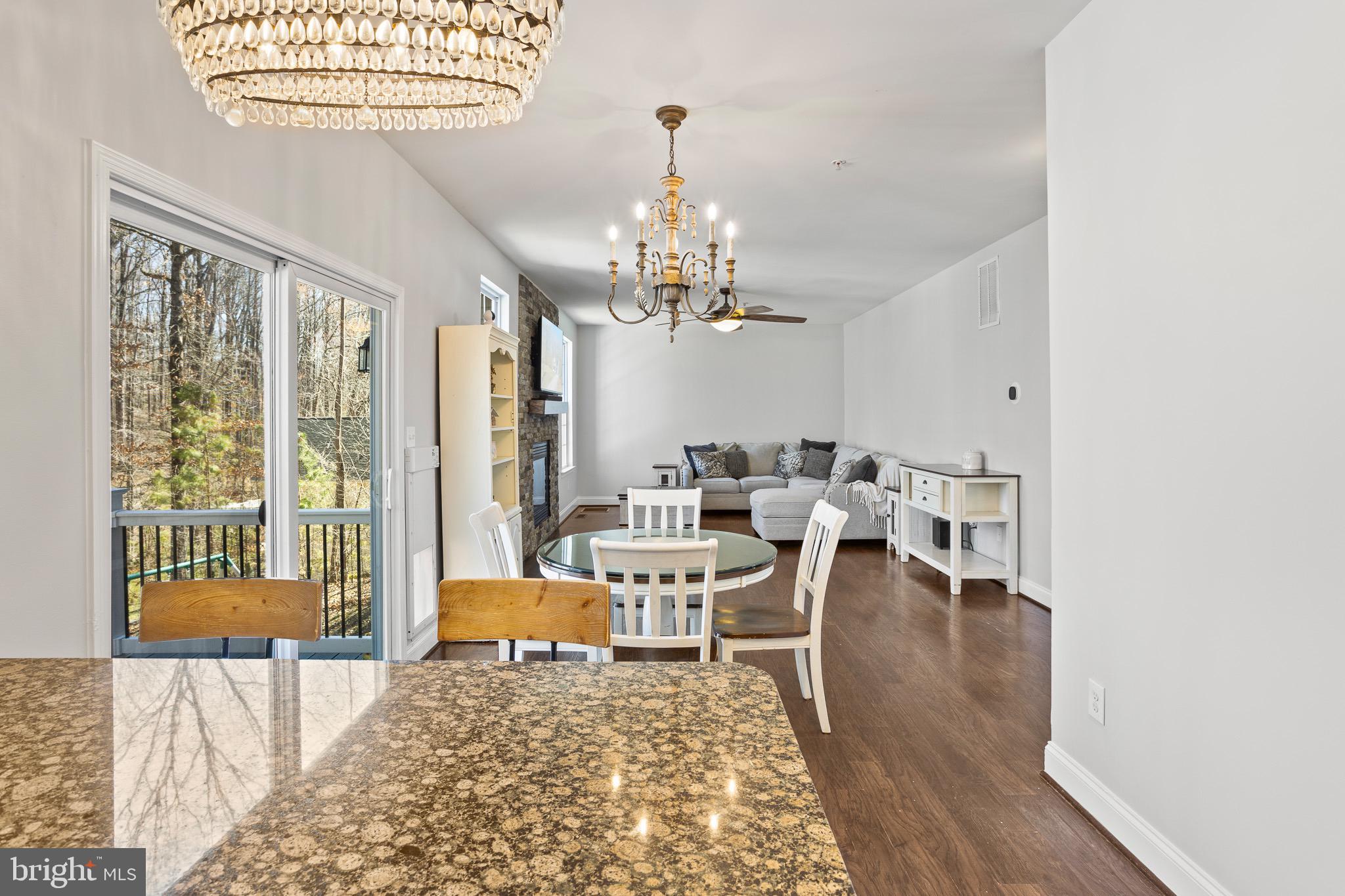 4335 Pleasant Court Huntingtown, MD 20639 - Photo 10 of 46 a living room with furniture and a chandelier