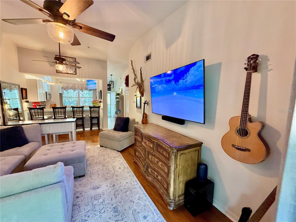 100 San Juan Drive, Unit A203 Palm Coast, FL 32137 - Photo 12 of 59 a living room with furniture and a flat screen tv