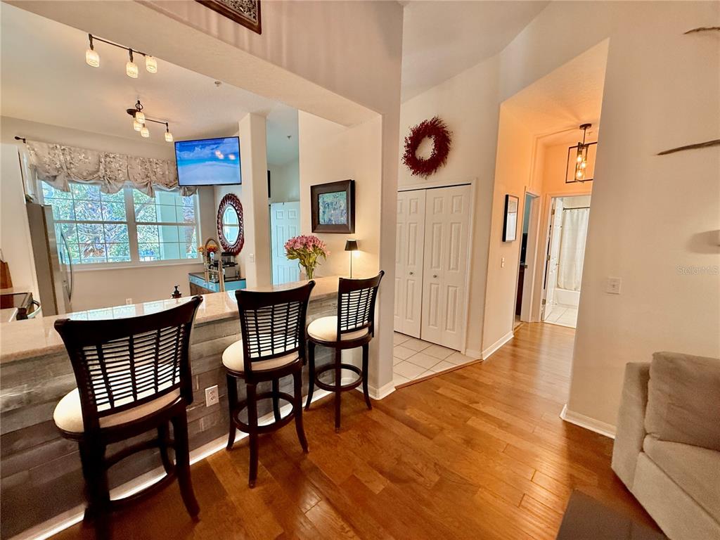 100 San Juan Drive, Unit A203 Palm Coast, FL 32137 - Photo 16 of 59 a dining room with furniture window and wooden floor