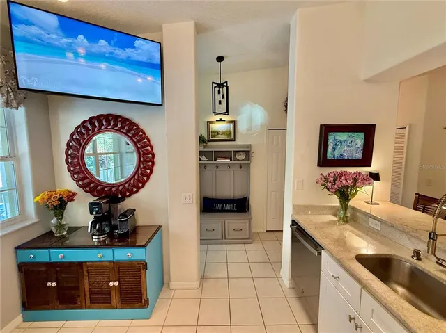 a bathroom with a sink a mirror and a rug