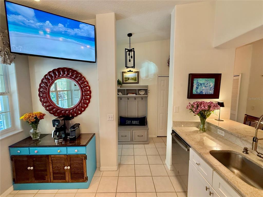 100 San Juan Drive, Unit A203 Palm Coast, FL 32137 - Photo 18 of 59 a bathroom with a sink a mirror and a rug