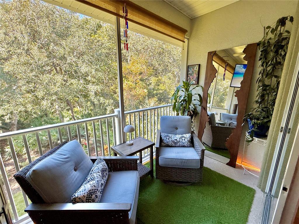 100 San Juan Drive, Unit A203 Palm Coast, FL 32137 - Photo 27 of 59 a view of a porch with furniture