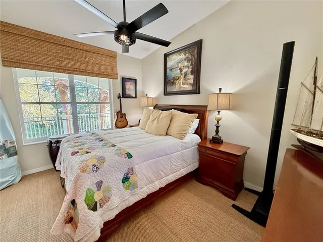 a bedroom with a bed dresser and a window