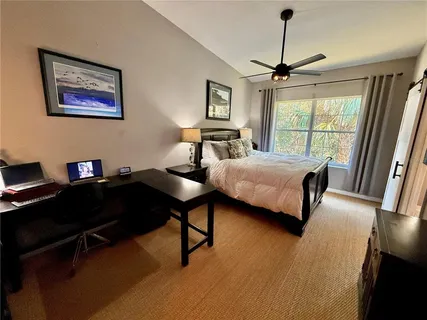 a bedroom with a bed furniture and a window