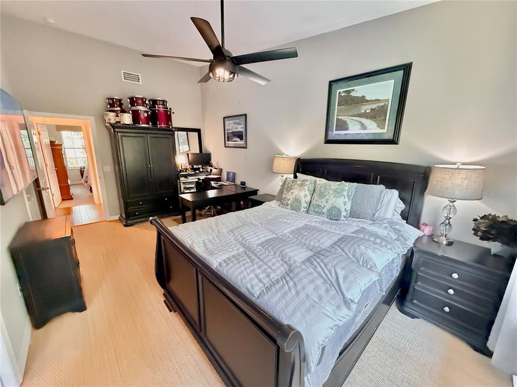 100 San Juan Drive, Unit A203 Palm Coast, FL 32137 - Photo 37 of 59 a bedroom with a bed and wooden floor