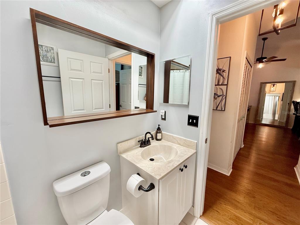 100 San Juan Drive, Unit A203 Palm Coast, FL 32137 - Photo 39 of 59 a bathroom with a sink a toilet and shower