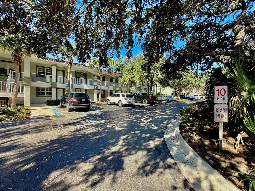 100 San Juan Drive, Unit A203 Palm Coast, FL 32137 - Photo 4 of 59 a car parked on the side of a street