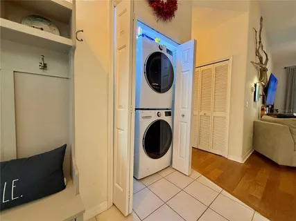 a view of a storage & utility room with a washer dryer