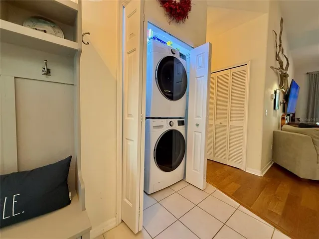 a view of a storage & utility room with a washer dryer