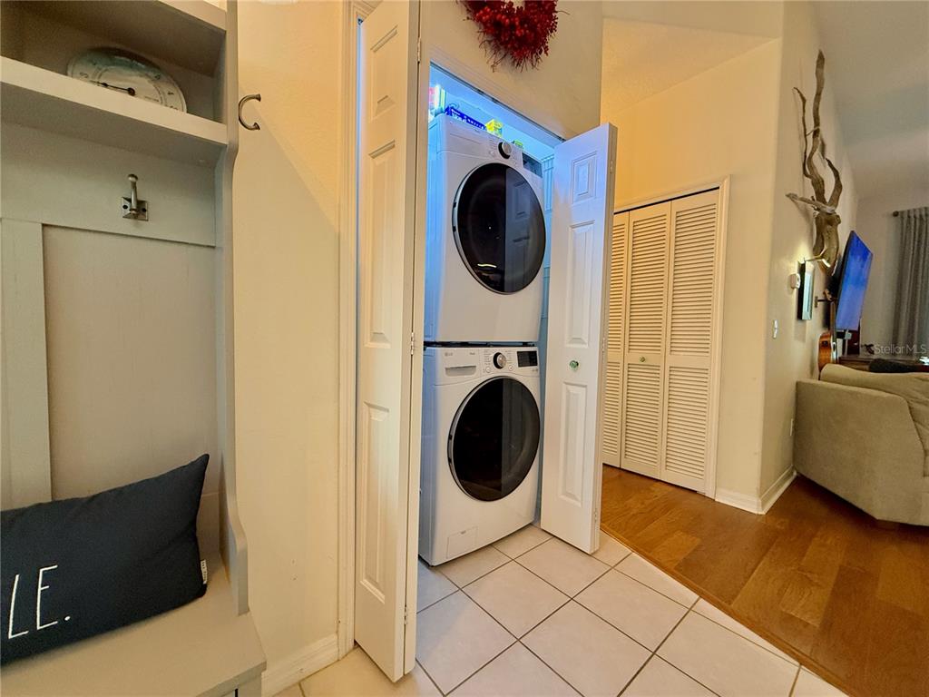 100 San Juan Drive, Unit A203 Palm Coast, FL 32137 - Photo 41 of 59 a view of a storage & utility room with a washer dryer