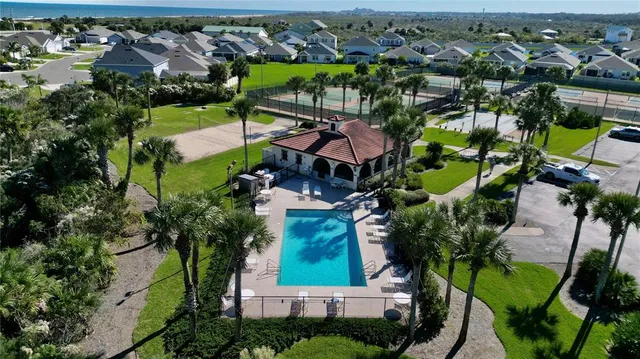 an aerial view of a house with a garden
