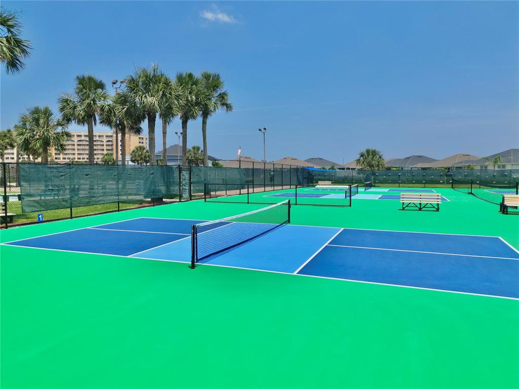 100 San Juan Drive, Unit A203 Palm Coast, FL 32137 - Photo 47 of 59 a view of an outdoor space and tennis court
