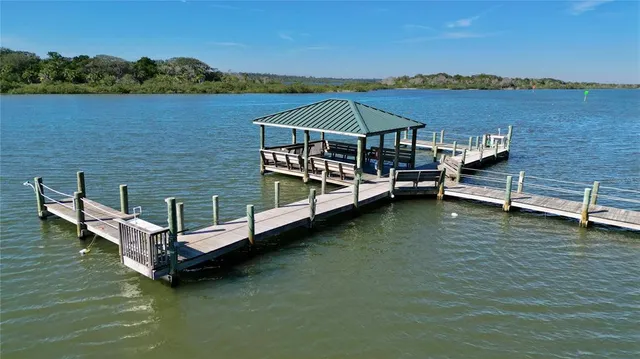 an aerial view of a house with a lake view