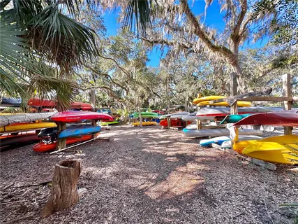 an aerial view of residential houses with outdoor space and ocean view