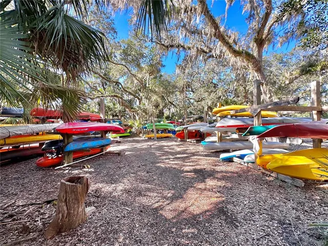 an aerial view of residential houses with outdoor space and ocean view