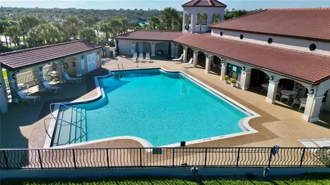 an aerial view of a house with a garden