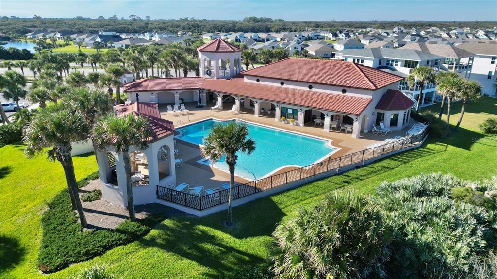100 San Juan Drive, Unit A203 Palm Coast, FL 32137 - Photo 56 of 59 an aerial view of a house with a garden