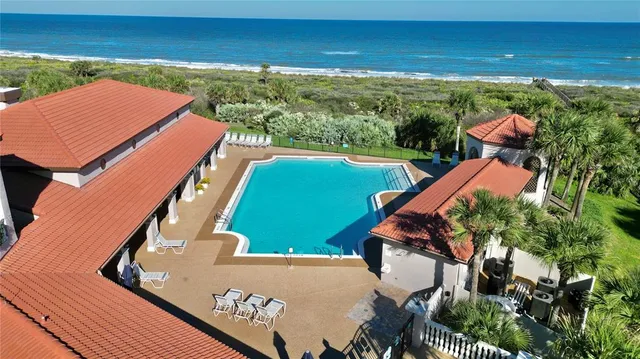 an aerial view of a house with a garden
