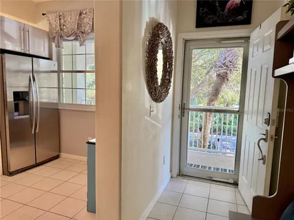 a view of a kitchen with a large window