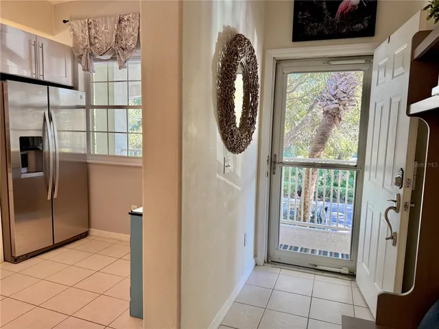 a view of a kitchen with a large window
