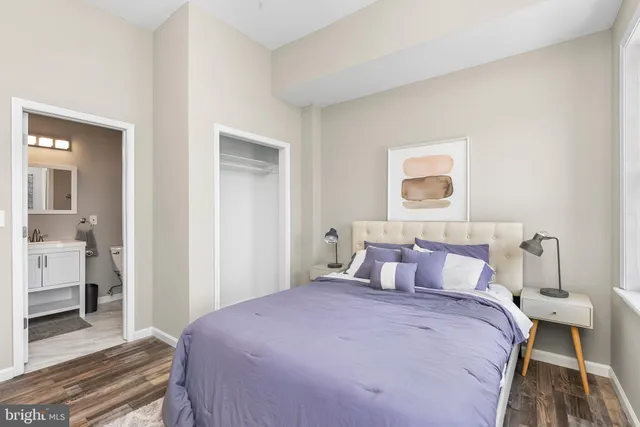 a bathroom with a sink mirror toilet and shower