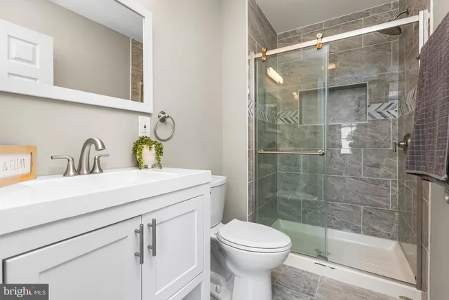 a kitchen with stainless steel appliances a refrigerator and a stove top oven