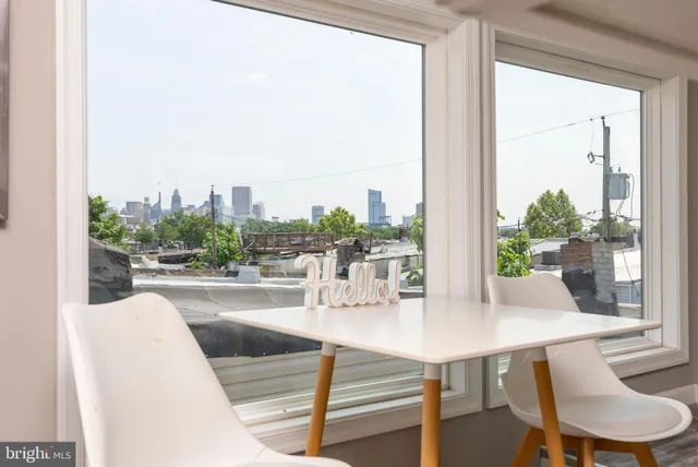 a kitchen with granite countertop a sink stove and cabinets