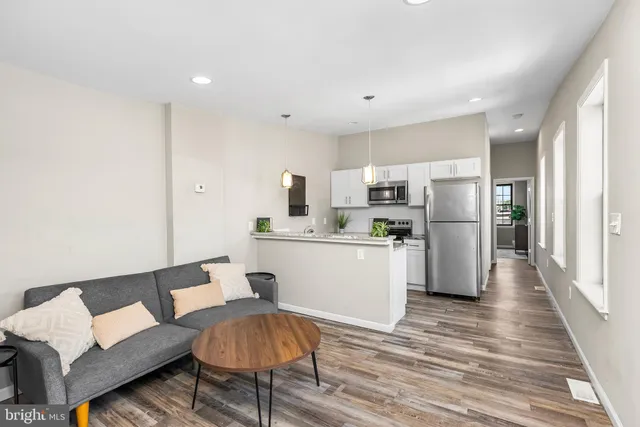 a bedroom with bed and a chandelier