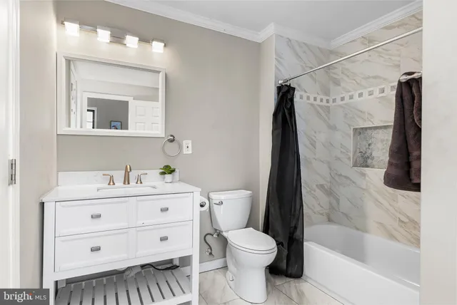 a close view of a utility room with dryer and washer