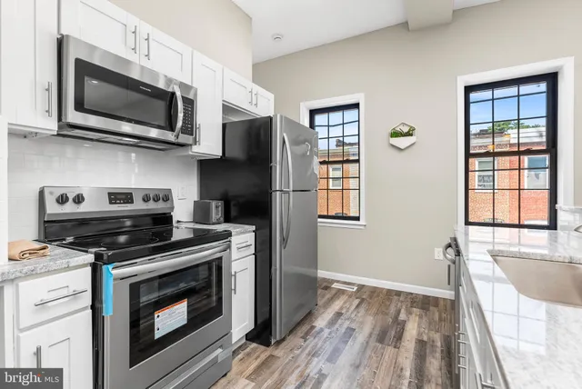 a bedroom with a bed and a mirror