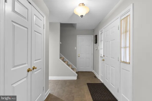 a view of a hallway with a white walls