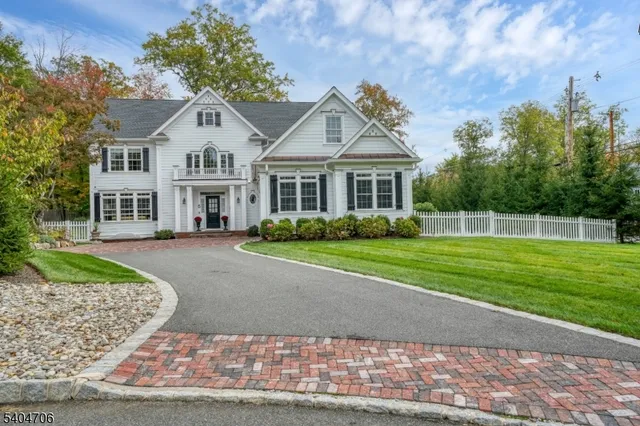 a view of entryway dining room and hall with wooden floor