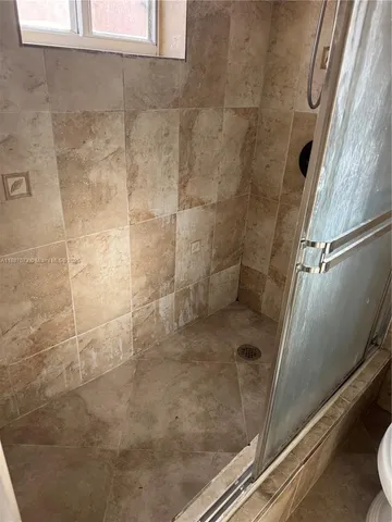 a view of an empty room and wooden floor