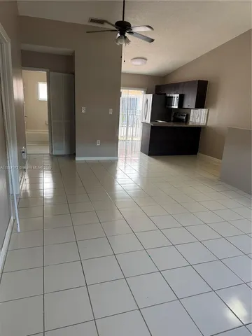 a kitchen with stainless steel appliances granite countertop a sink stove and microwave