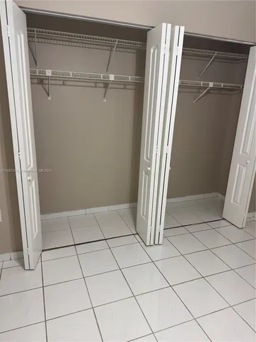 a bathroom with a toilet and a bathtub