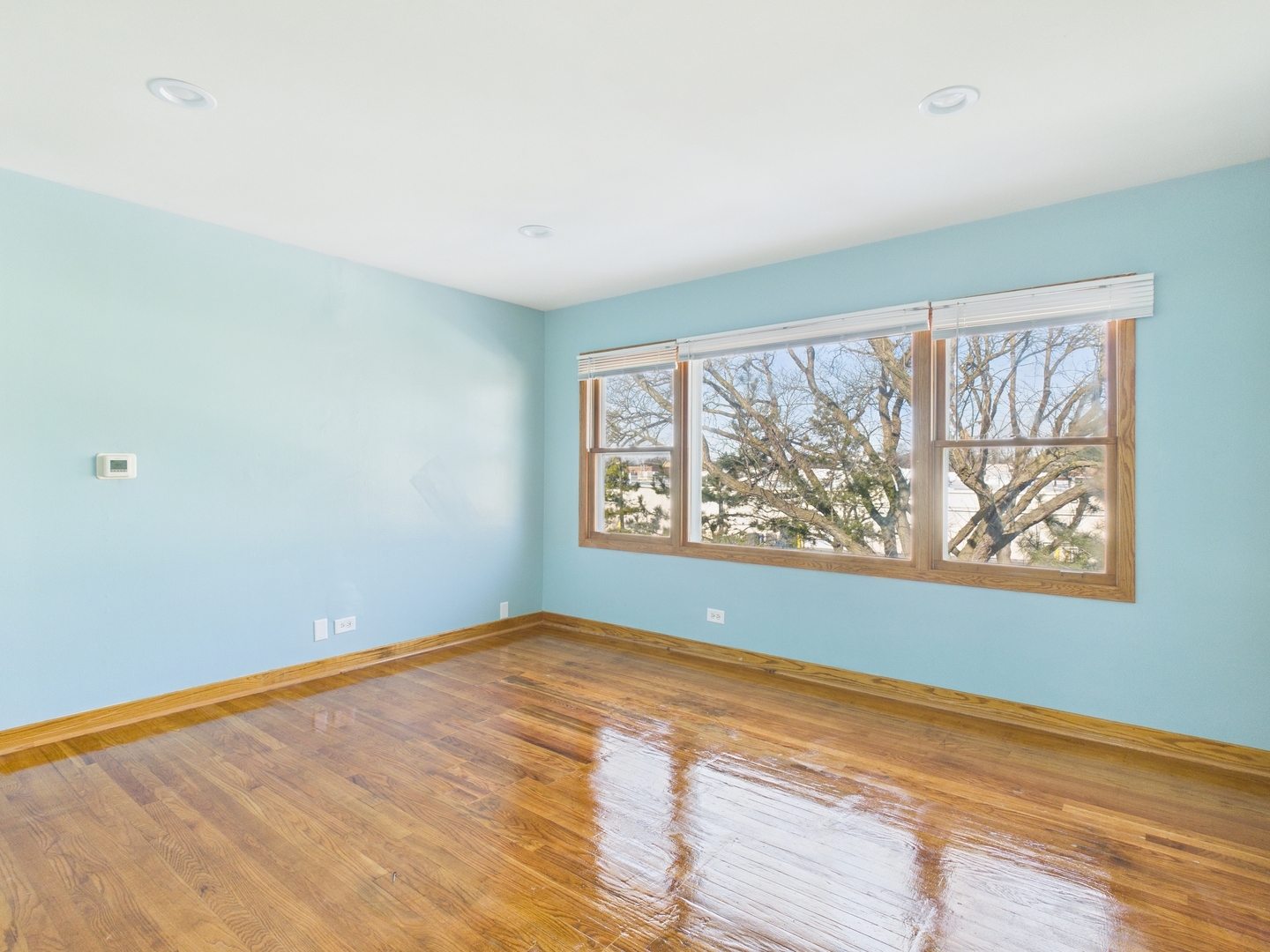 755 Dulles Road, Unit F Des Plaines, IL 60016 - Photo 3 of 12 a view of an empty room with a window