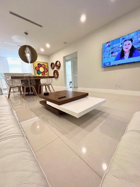 1125 99th Street, Unit 12 Bay Harbor Islands, FL 33154 - Photo 13 of 62 a living room with furniture and a view of kitchen