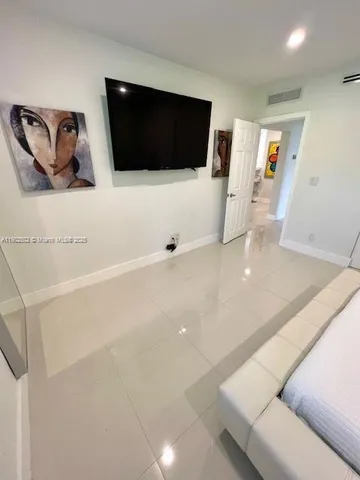 a bathroom with a sink double vanity and a mirror