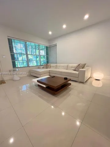 a living room with furniture and window