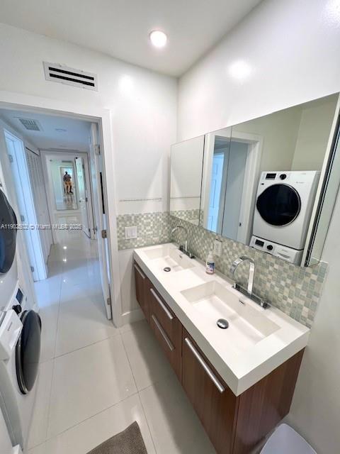 1125 99th Street, Unit 12 Bay Harbor Islands, FL 33154 - Photo 22 of 62 a bathroom with a sink double vanity and a mirror