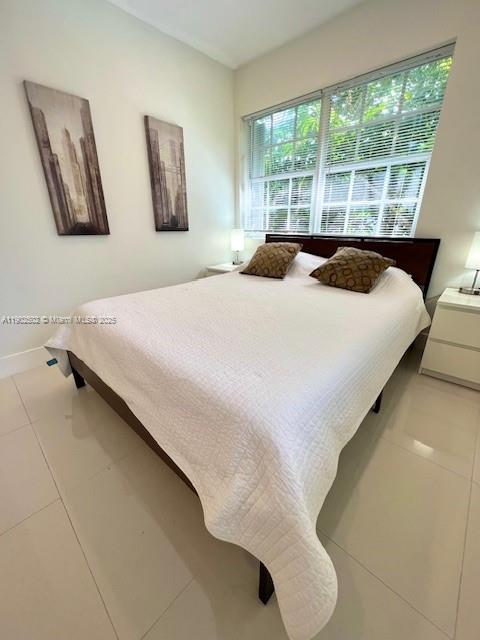 1125 99th Street, Unit 12 Bay Harbor Islands, FL 33154 - Photo 25 of 62 a bedroom with a bed and window