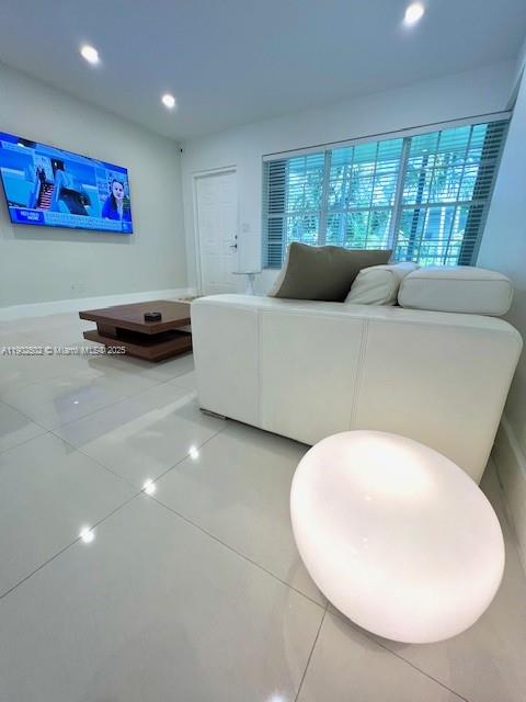 1125 99th Street, Unit 12 Bay Harbor Islands, FL 33154 - Photo 3 of 62 a living room with furniture and window