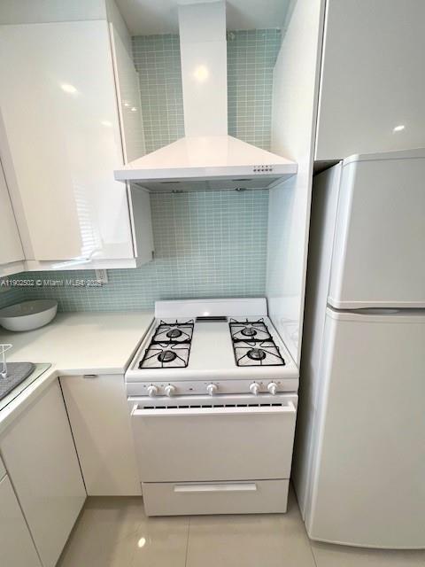 1125 99th Street, Unit 12 Bay Harbor Islands, FL 33154 - Photo 31 of 62 a stove top oven sitting inside of a kitchen