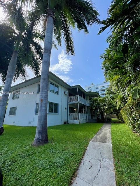 1125 99th Street, Unit 12 Bay Harbor Islands, FL 33154 - Photo 35 of 62 a front view of house with yard and green space