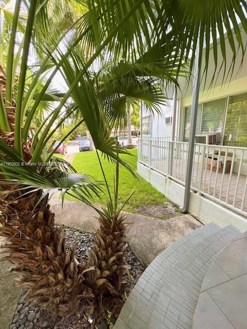 1125 99th Street, Unit 12 Bay Harbor Islands, FL 33154 - Photo 36 of 62 a view of backyard with palm trees