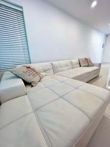 a kitchen with a sink a stove and cabinets